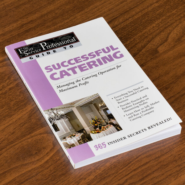 A copy of Successful Catering on a table at a catering event.