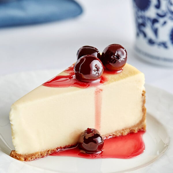A slice of cheesecake with Fabbri Amarena cherries on top.