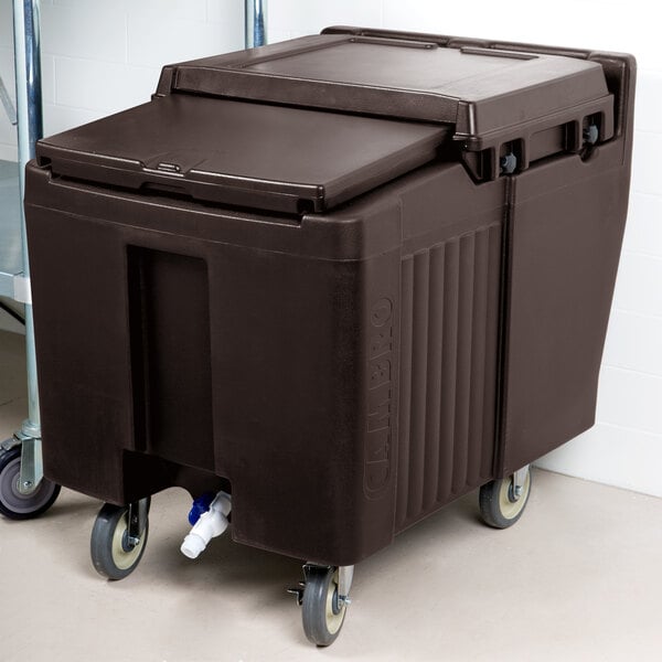 A large brown plastic container with wheels.