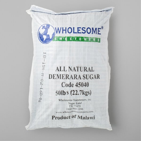 A white bag of Wholesome Raw Natural Demerara Turbinado Sugar with black, blue, and green text.