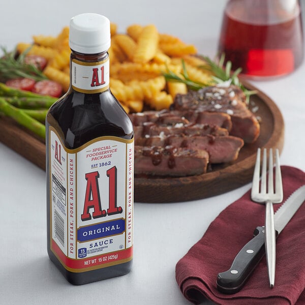 A case of A.1. Original Steak Sauce bottles next to a plate of steak with a fork and knife.