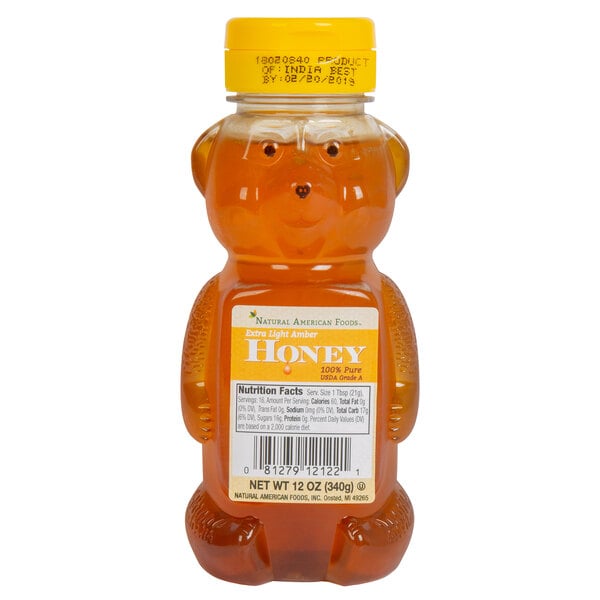 A case of 12 Natural American honey bottles with yellow lids, featuring a honey bear.