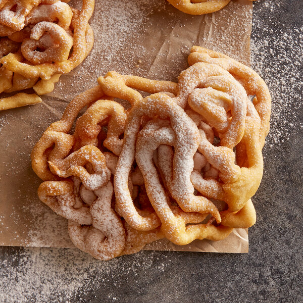 J & J Snack Foods funnel cakes with powdered sugar on top.