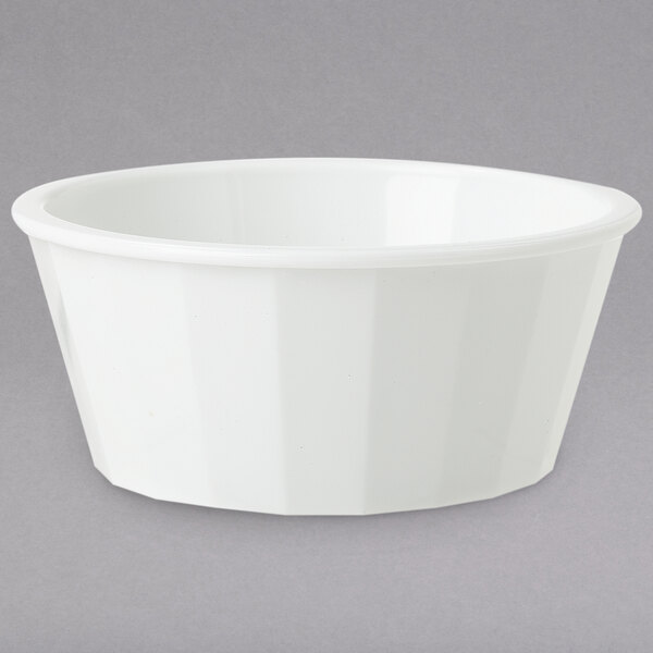 A white GET fluted plastic ramekin on a grey background.