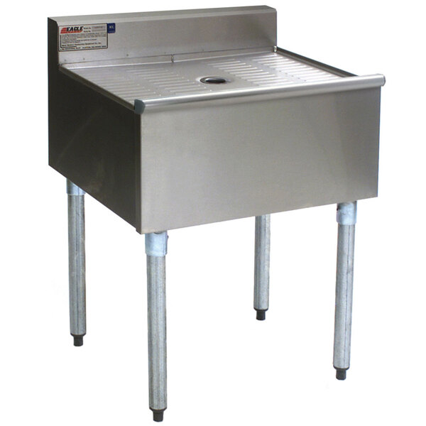 An Eagle Group stainless steel workstation with legs and a drain.