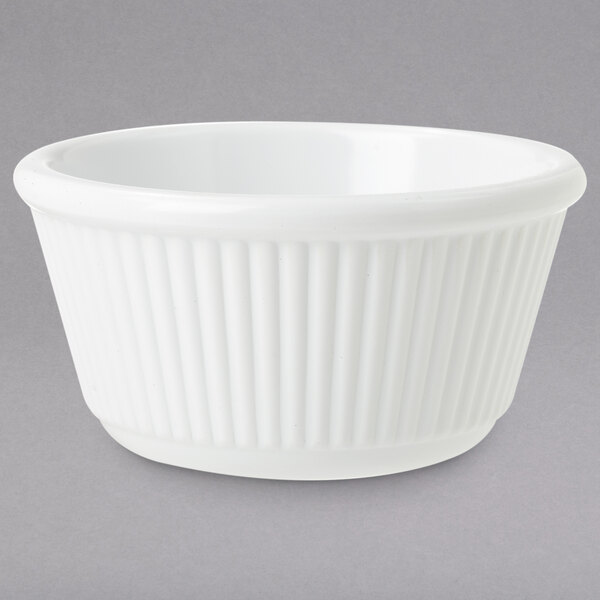 A white bowl with a ribbed pattern.
