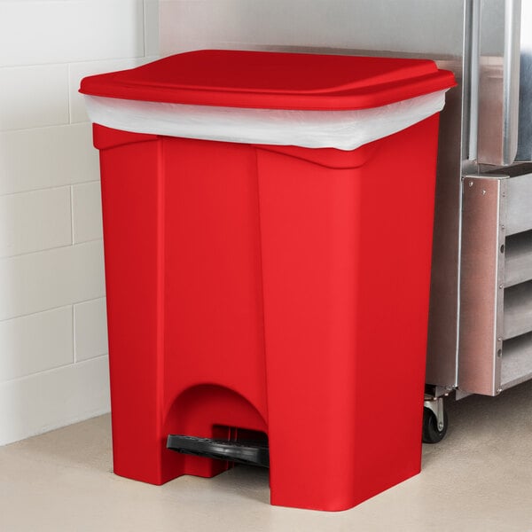 A red Lavex rectangular step-on trash can with a lid.