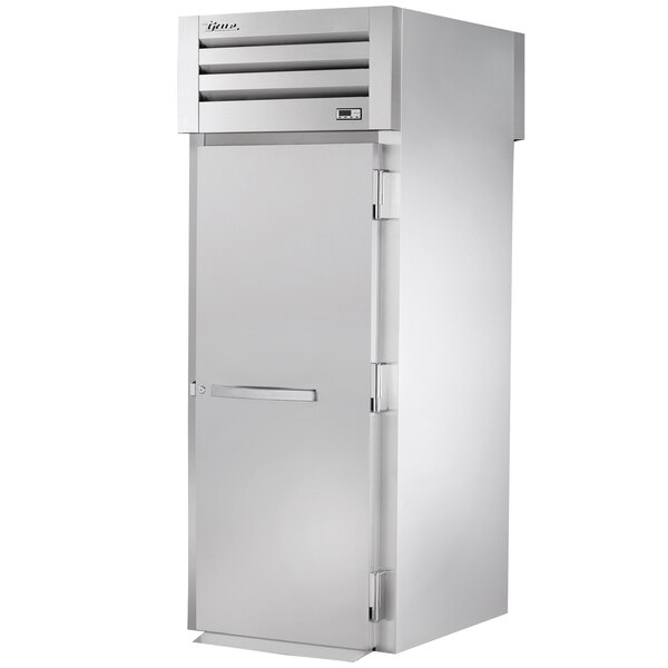 A True stainless steel roll-through refrigerator with a rectangular white door and a silver handle.