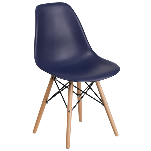 A navy plastic chair with wooden legs.