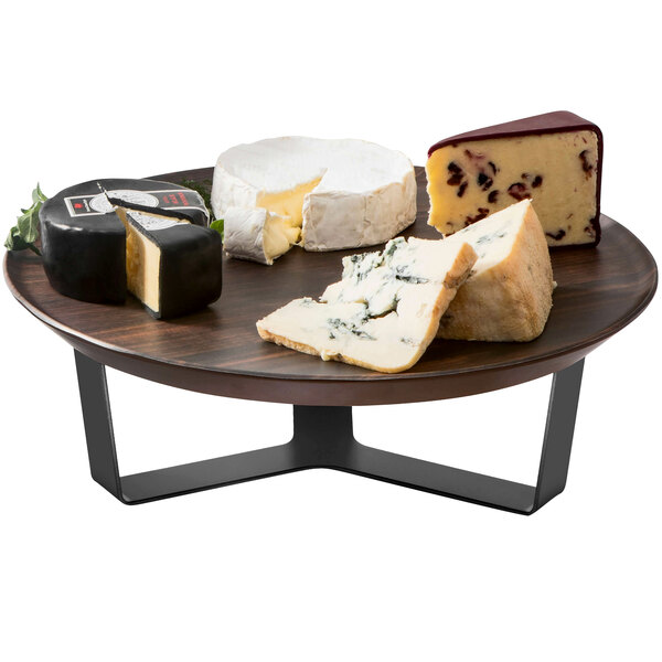 A Rosseto walnut melamine tray with a round white cheese with a slice missing on it.