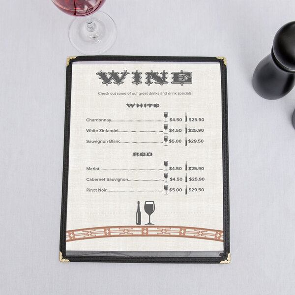 An Asian themed menu with a wine glass on a table.