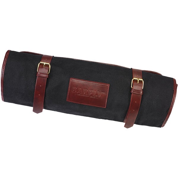 A Barfly black fabric gear roll with brown leather accents.