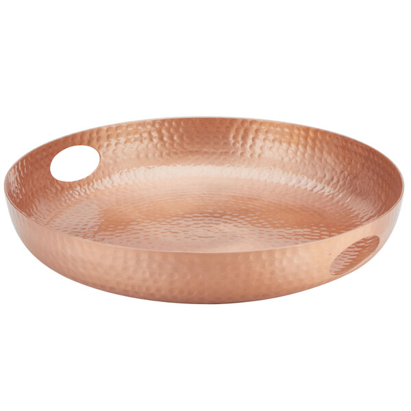 An American Metalcraft copper hammered aluminum tray with a white bowl on a brown surface.