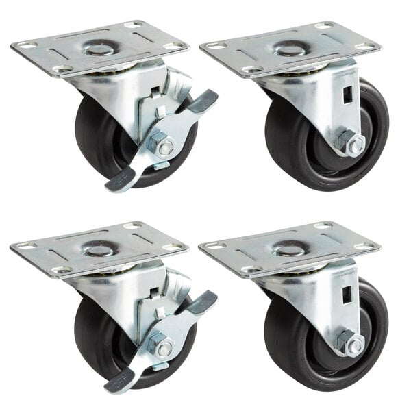 A set of four black swivel plate casters with black rubber wheels.