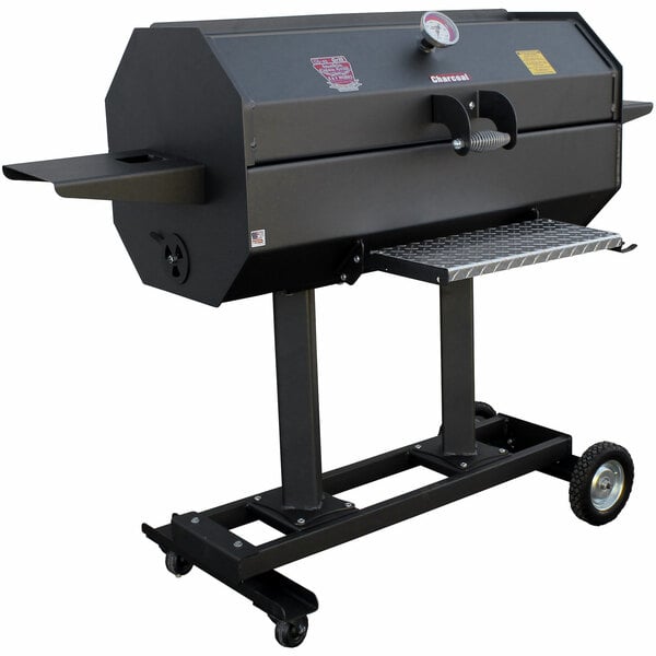 A black R & V Works Smokin' Cajun charcoal grill on wheels with a gauge.
