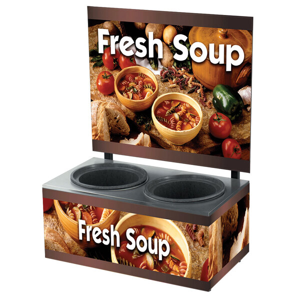 A Vollrath countertop soup merchandiser base with country kitchen graphics and a bowl of soup with pasta and vegetables.