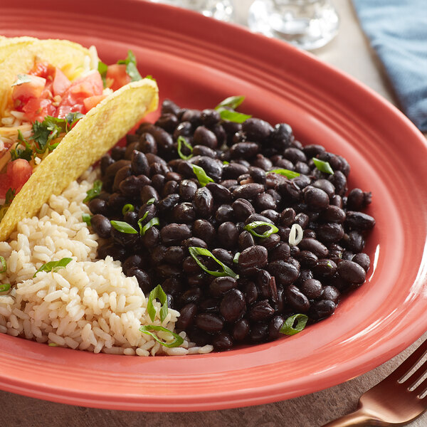 A plate of food with Furmano's organic black beans and rice.
