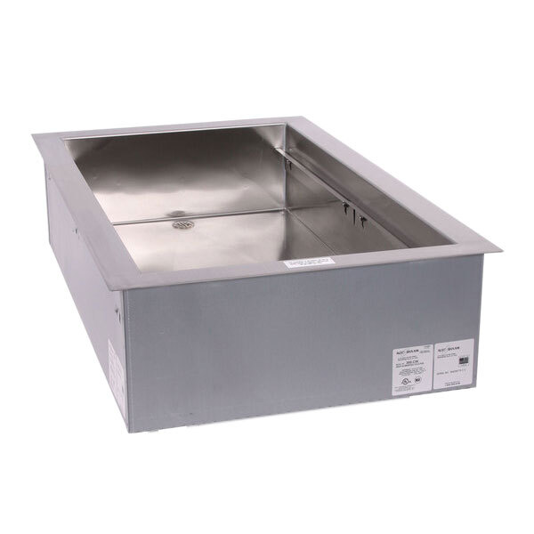 A rectangular stainless steel drop-in cold food well with a drain.