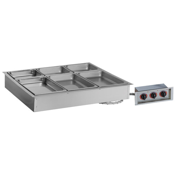 A rectangular stainless steel drop-in hot food well with four compartments.