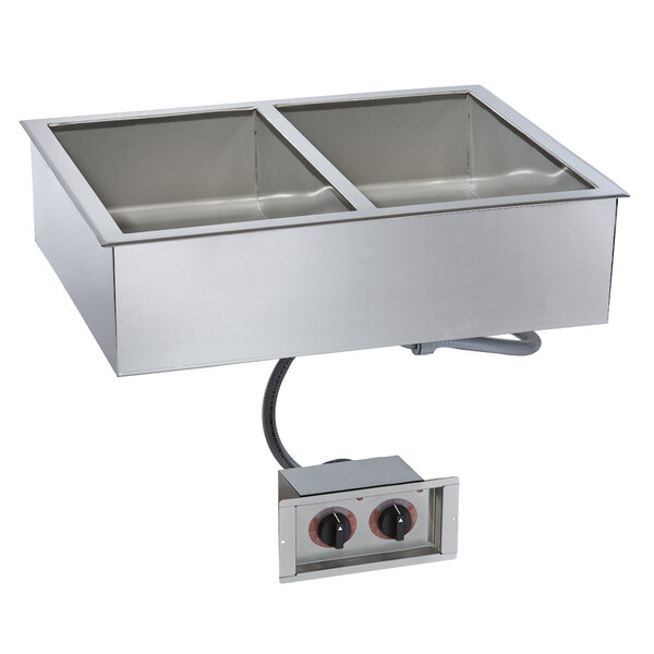 A stainless steel drop-in hot food well with two compartments on a counter.