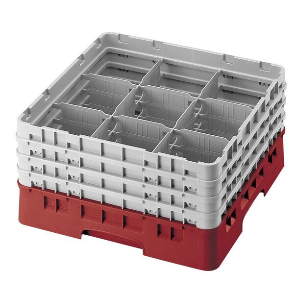 A red and white plastic Cambro glass rack with 9 compartments and 5 extenders.