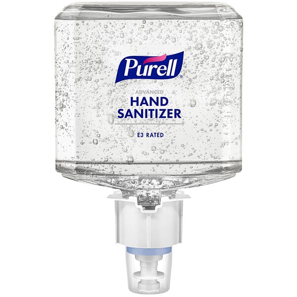 A Purell ES6 hand sanitizer dispenser on a hotel buffet table.