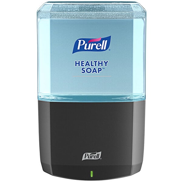 A Purell ES8 graphite automatic hand soap dispenser with a blue liquid in it.