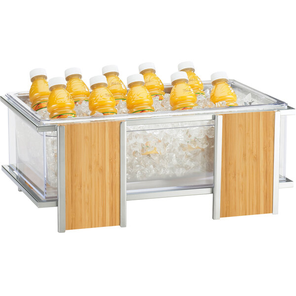 A Cal-Mil ice housing with bottles of orange juice in ice.