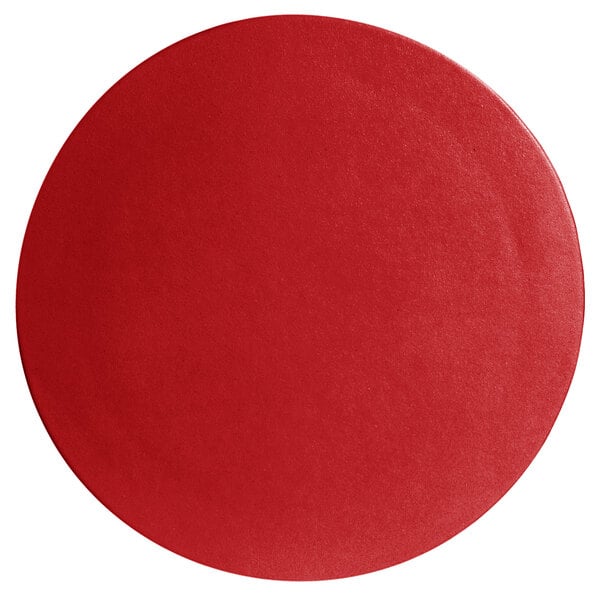 A cranberry red G.E.T. Enterprises large round disc with a smooth surface.