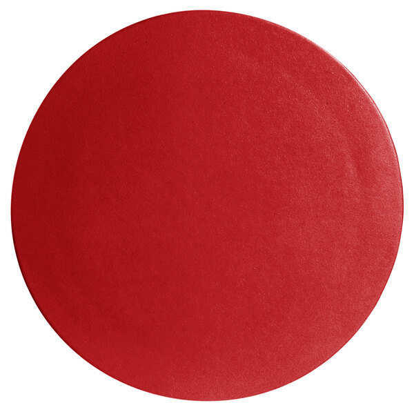 A cranberry red small round disc with a smooth surface.
