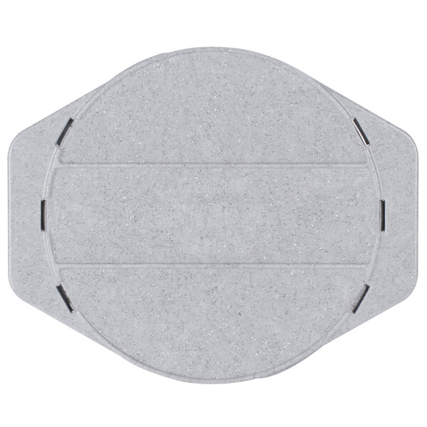 A grey circular plastic plate with black metal rivets.
