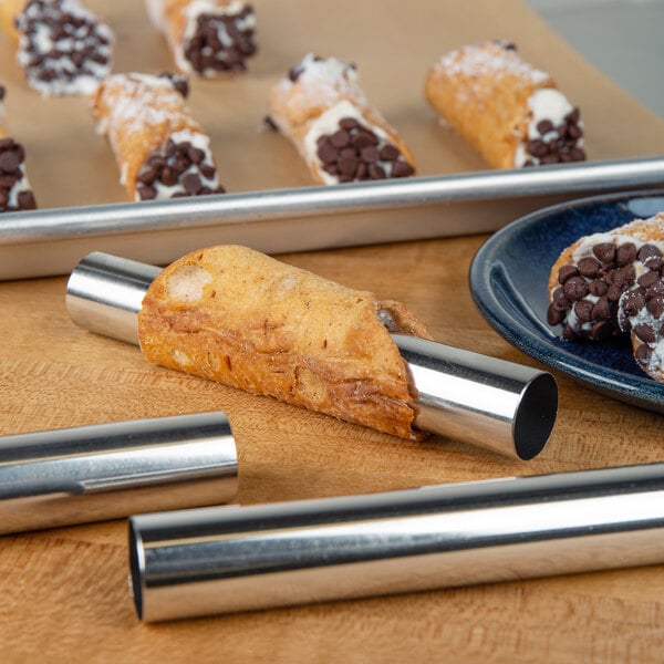 A cannoli made using a Fox Run tin plated steel form with chocolate chips on the ends.