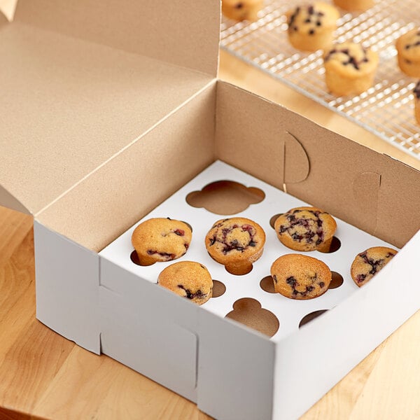 A Baker's Mark reversible cupcake insert holding 12 mini muffins on a table.