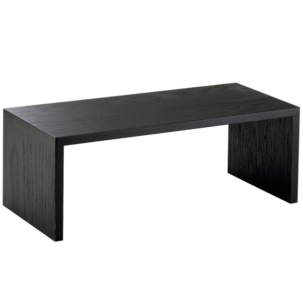 A black rectangular table with a Cal-Mil Midnight Wood Bridge Riser on top.