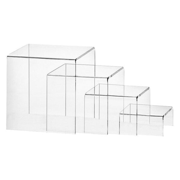 A group of Cal-Mil clear acrylic nesting risers with different sizes.