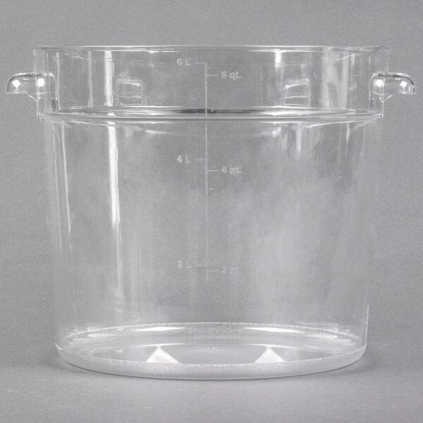 A Carlisle clear plastic food storage container with a handle.