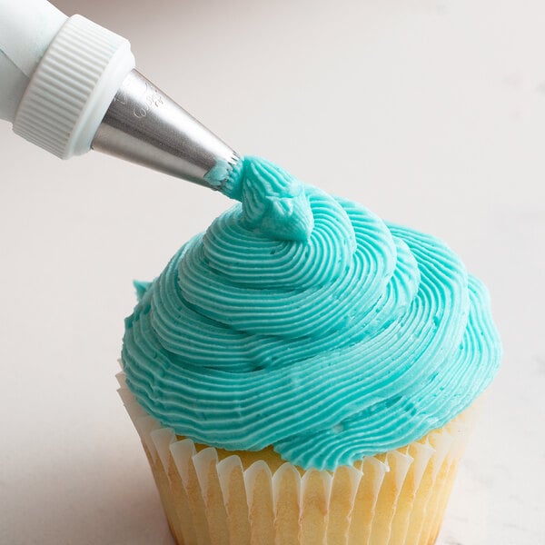 A cupcake with blue frosting piped using an Ateco French Star piping tip.