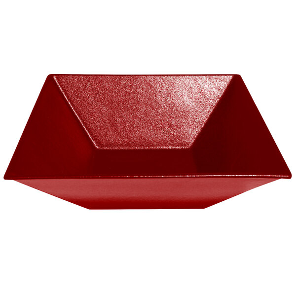 A red metal square bowl with a smooth finish.
