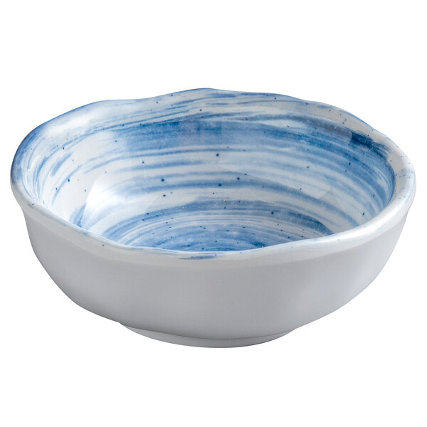 A white melamine bowl with blue swirls.