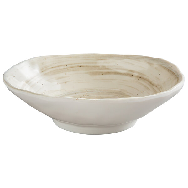 A white oval melamine bowl with brown speckled lines.