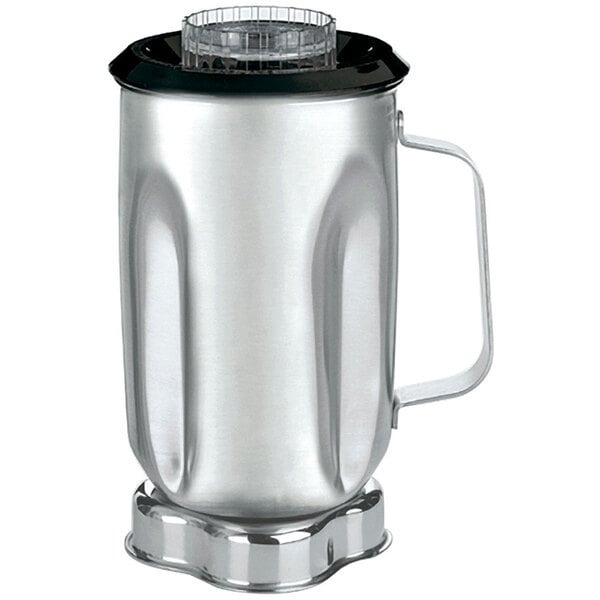 A close up of a silver Waring stainless steel blender container with a black lid and handle.