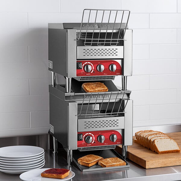 An Avantco double stacked commercial conveyor toaster with toast on top.