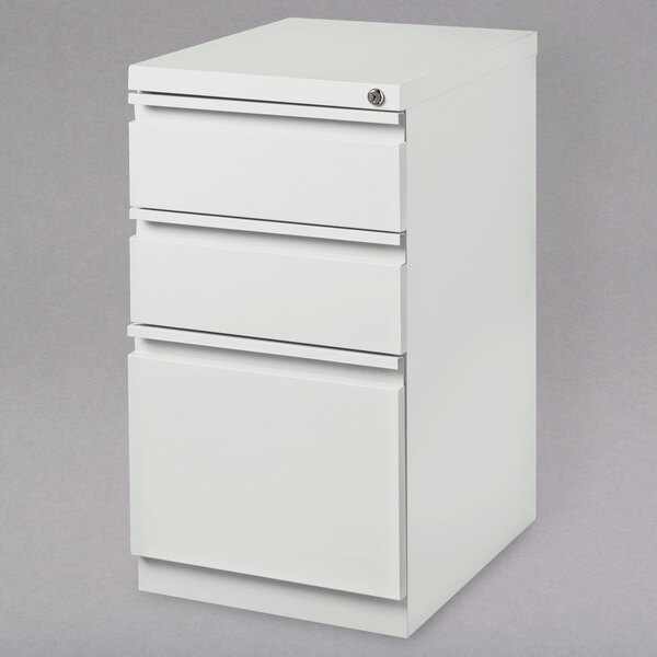A white Hirsh Industries mobile pedestal file cabinet with drawers.