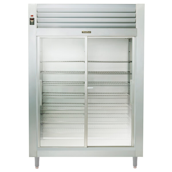A Traulsen stainless steel reach-in refrigerator with glass doors.