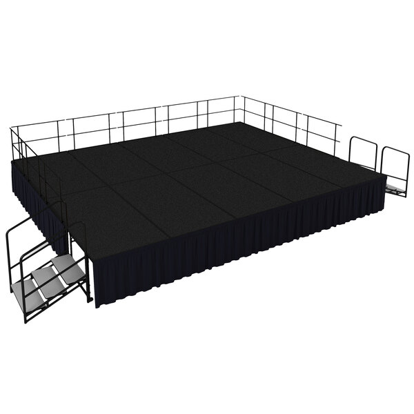 A black stage with metal railings and stairs.