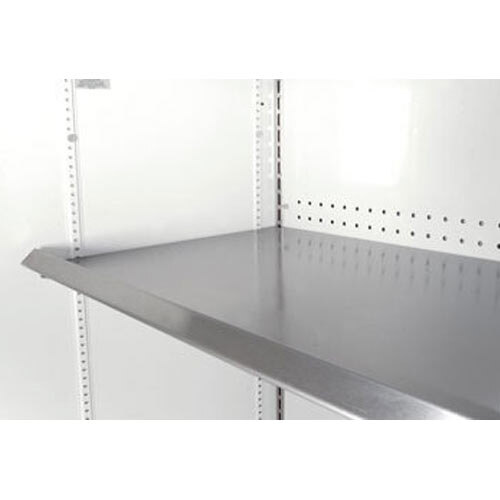 A close-up of a stainless steel True mezzanine shelf with holes in it.