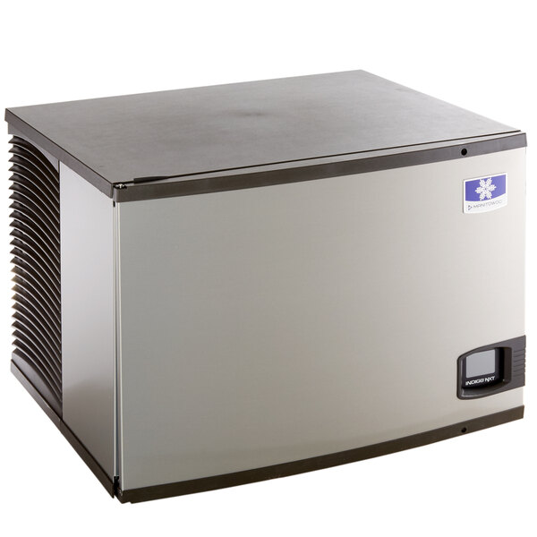 A silver rectangular Manitowoc water cooled ice machine with a black square on top.