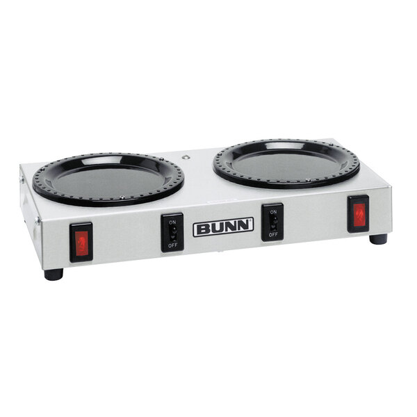 A Bunn double burner coffee warmer with two black burners on a white surface.
