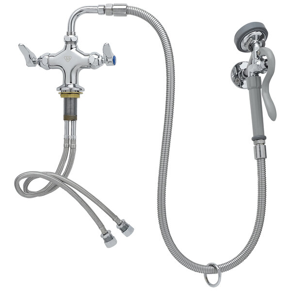 A T&S deck mounted pre-rinse faucet with a hose and wall hook.