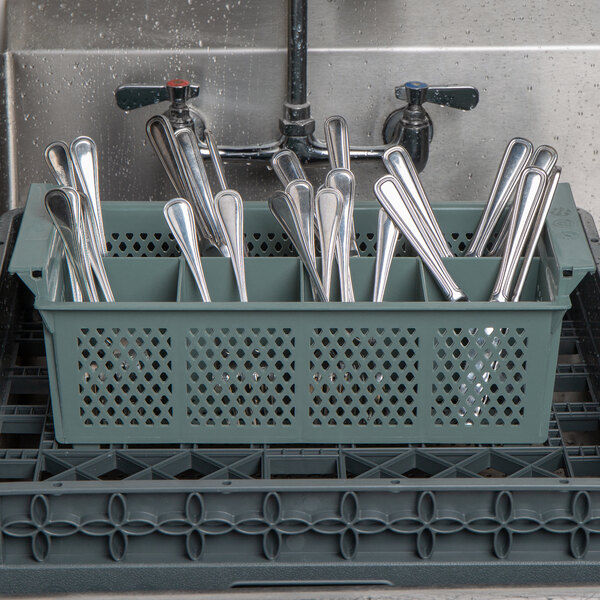 A Noble Products metal rack holding silverware baskets.